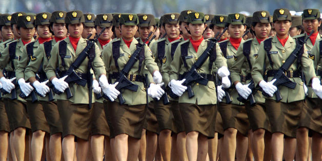 JAKARTA, INDONESIA: Indonesian Army women march during the rehearsal of the 59th anniversary of the creation of the Indonesian military forces in Jakarta, 03 October 2004. With only hours remaining in their mandate, Indonesian legislators approved 30 September 2004 a controversial new law governing the armed forces as demonstrators warned of a military return to politics. The 59th anniversary of the creation of the Indonesian military forces will be celebrated 05 October 2004. AFP PHOTO/Bay