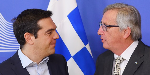 Greece's Prime Minister Alexis Tsipras (L) is welcome by European Commission President Jean-Claude Juncker at the European Commission in Brussels on March 13, 2015. Tsipras is in Brussels for talks on Athens' debt-hit bailout. AFP PHOTO/Emmanuel Dunand (Photo credit should read EMMANUEL DUNAND/AFP/Getty Images)