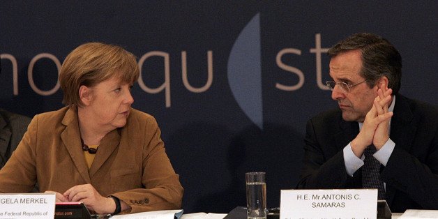ATHENS, GREECE - APRIL 11: Greece's Prime Minister Antonis Samaras (R) speaks with German Chancellor Angela Merkel before a meeting with young Greek businessmen on April 11, 2014 in Athens, Greece. Merkel arrived for a brief visit, a day after the crisis-hit country returned to international bond markets. (Photo by Milos Bicanski/Getty Images)