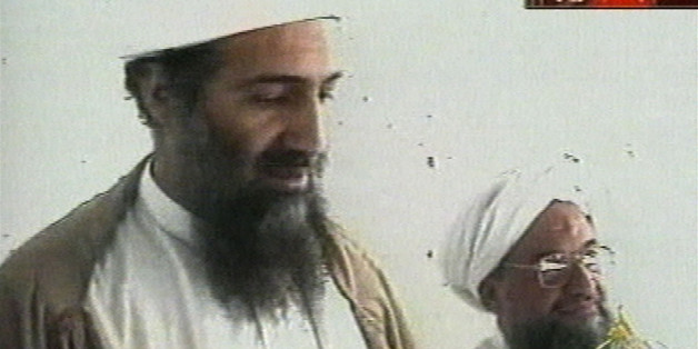 This image taken from video released by Qatar's Al-Jazeera televison broadcast on Friday Oct. 5, 2001 is said to show Osama bin Laden, the prime suspect in the Sept. 11, 2001 terrorist attacks on the United States, at an undisclosed location. Al-Jazeera did not say whether the image was taken before or after the Sept. 11 attacks or how they obtained it. At right is bin Laden's top lieutenant, Egyptian Ayman al-Zawahri. Bin Laden is believed to have been at a celebration of the union of his al-Qaida network and al-Zawahri's Egyptian Jihad group. Graphic at top right reads "Exclusive to Al-Jazeera." At bottom right is the station's logo which reads "Al-Jazeera." (AP Photo/Al-Jazeera via APTN)