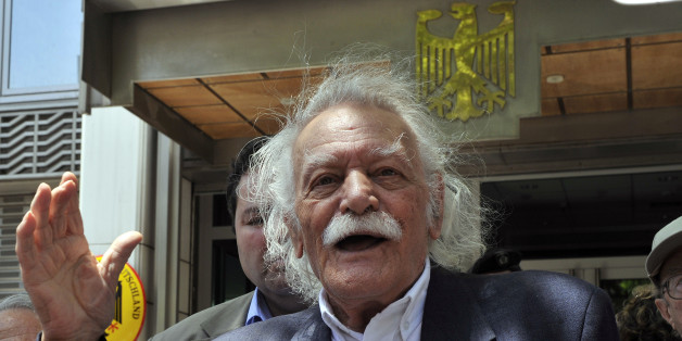TO GO WITH AFP STORY BY CATHERINE BOITARD
(FILES) In this photo taken on June 6, 2011, activist and writer Manolis Glezos speaks to the press outside the German embassy in Athens. Glezos, an emblematic figure of Greece's radical left movement and the country's fight against Nazi Germany, attended the parliament session on February 12 where government coalition parties -- at a heavy cost -- approved a new round of unpopular austerity measures to clinch a 130-billion-euro eurozone bailout. At 89 years of age, Glezos has created with Greek composer Mikis Theodorakis a new activist group named 'Elada' dedicated to fighting against the recent austerity measures approved by the Greek parliament and foreign influence in Greek politics. AFP PHOTO / LOUISA GOULIAMAKI (Photo credit should read LOUISA GOULIAMAKI/AFP/Getty Images)