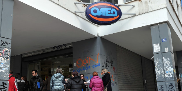 People wait outside the Manpower Employment Organization ( OAED) in Athens on December 19, 2013. Greece has a staggering unemployment rate of more than 27 percent, with some 1.37 million people registered as jobless. Greece's jobless rate fell to 27 percent in the third quarter of 2013 from 27.1 percent in the previous three-month period as the pace of the economy's contraction eased, the country's statistics service said on December 19. AFP PHOTO / LOUISA GOULIAMAKI (Photo credit should read LOUISA GOULIAMAKI/AFP/Getty Images)
