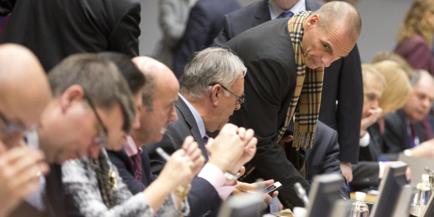 Greek Finance Minister Yanis Varoufakis, fourth right, takes his seat during a meeting of eurogroup finance ministers in Brussels on Wednesday, Feb. 11, 2015. Leading European officials downplayed expectations that a comprehensive debt deal with Greece is likely Wednesday at an emergency meeting in which Greeceâs finance minister is set to unveil a plan to loosen austerityâs grip on his economy. (AP Photo/Virginia Mayo)