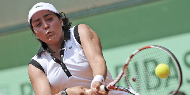Ons Jabeur of Tunesia returns against Monica Puig of Puerto Rico in the girls singles final of the French Open tennis tournament in Roland Garros stadium in Paris, Sunday June 5, 2011. (AP Photo/Laurent Baheux)