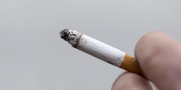 A man smokes a cigarette on May 9, 2015 in Paris. AFP PHOTO / KENZO TRIBOUILLARD (Photo credit should read KENZO TRIBOUILLARD/AFP/Getty Images)