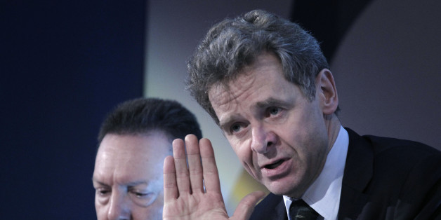 IMFâs troika representative to Greece Poul Thomsen, right, speaks as Greek Financial Minister Yannis Stournaras listens during a conference on the economy in central Athens, Monday, April 15, 2013. Greece cleared a key hurdle in its drive to receive its next batch of bailout loans after international debt inspectors said Monday they had reached an agreement over the countryâs economic reforms, including the firing of civil servants.(AP Photo/Petros Giannakouris)