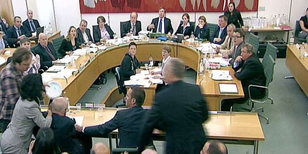 Box office: Comedian "Jonnie Marbles" confronts Rupert Murdoch with a paper plate covered in shaving foam as he gave evidence to the Culture, Media and Sport Select Committee on the News of the World phone-hacking scandal. Committees are not always this dramatic.