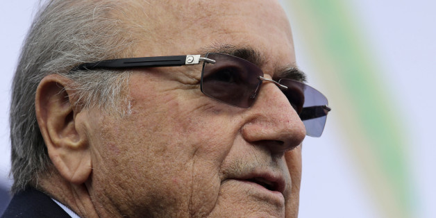 FIFA President Joseph S. Blatter addresses the crowd during the groundbreaking ceremony for a Football Artificial Turf under the FIFA Goal Project III in the country Sunday, Nov. 30, 2014 at Carmona township, Cavite province south of Manila, Philippines. The full size pitch will serve as the training facility and possible football stadium to boost football development in the Philippines. Blatter is here for the AFC (Asian Football Confederation) Player of the Year awards ceremony as well as the