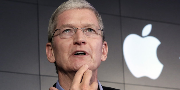 Apple CEO Tim Cook responds to a question during a news conference at IBM Watson headquarters, in New York, Thursday, April 30, 2015. Apple, IBM and Japanese insurance and bank holding company Japan Post have formed a partnership to improve the lives of elderly people in the country. The program will provide iPads with apps designed to help seniors manage day-to-day lives and keep in touch with family members. (AP Photo/Richard Drew)