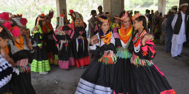 RUMBUR, PAKISTAN - MAY 15: Girls from the polytheistic Kalash tribe dance at the Joshi spring festival May 15, 2008 in the remote Chitral village of Rumbur in northwestern Pakistan. The Kalash people, who number about 4,000, claim to be descendants of Alexander the Great and worship their own gods. The tiny minority group, in a Muslim nation of more than 165 million people, holds the annual spring festival, featuring dance, music and special prayers to bring good crops and honey to its agricultural communities. The Kalesh are the remnants of the pre-Islamic culture called 'Kafiristan,' what the Muslims called 'land of the unbelievers.' They are connected to the rest of Pakistan by a single road, and lack phone service to the outside world. (Photo by John Moore/Getty Images)