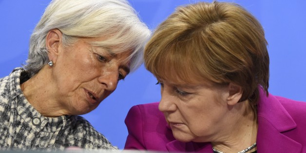 (From L) International Monetary Fund Managing Director Christine Lagarde and German Chancellor Angela Merkel address a press conference after talks at the chancellery in Berlin on March 11, 2015. AFP PHOTO / TOBIAS SCHWARZ (Photo credit should read TOBIAS SCHWARZ/AFP/Getty Images)