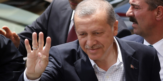 Turkeyâs President Recep Tayyip Erdogan waves to supporters after voting at a polling station in Istanbul, Turkey, Sunday, June 7, 2015. Turks are heading to the polls in a crucial parliamentary election that will determine whether ruling party lawmakers can rewrite the constitution to bolster the powers of Erdogan. All eyes will be on the results for the main Kurdish party, the Kurdish Peoples' Democratic Party, (HDP). If it crosses a 10 percent threshold for entering parliament as a party