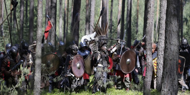 Enthusiasts dressed as characters from the fantasy novel "The Hobbit" by J. R. R. Tolkien take part in the battle of five armies near the town of Doksy, Czech Republic, Saturday, June 6, 2015. Several hundred people arrived in the forest to re-enact the famous battle from Tolkien's novel that was published for the first time in 1937. (AP Photo/Petr David Josek)