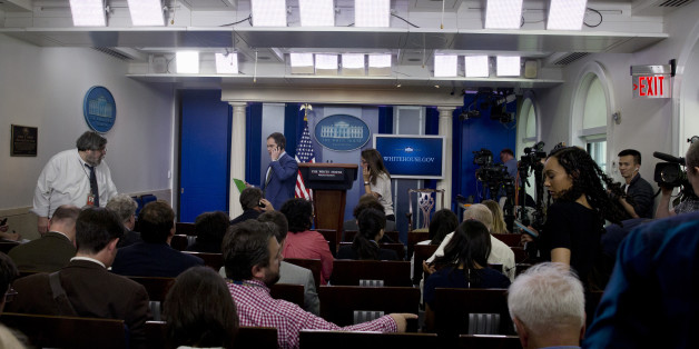 Members of the media enter the White House Briefing Room in Washington, Tuesday, June 9, 2015, to continue the daily briefing after press area was evacuated. Part of the White House was evacuated amid security concerns. Secret Service officers interrupted a live, televised press briefing with the White House press secretary on Tuesday and evacuated the James S. Brady Briefing Room shortly after 2 p.m. The officers would not say what prompted the evacuation, and the White House had no immediate information about the incident. (AP Photo/Carolyn Kaster)