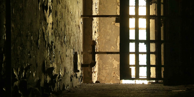 In this June 3, 2015, image taken from video, a hallway is shown in the old Meriwether County jail in Greenville, Ga. The jail, southwest of Atlanta, fell into disrepair after it closed in the mid-1980s. The 119-year-old relic of narrow, aged hallways and small, worn prison cells is being renovated into a home and museum. (AP Photo/Alex Sanz)