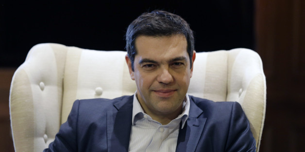 Greece's Prime Minister Alexis Tsipras meets Governor of the Bank of Greece Yannis Stournaras at Maximos Mansion in Athens, Friday, March 6, 2015. European Central Bank head Mario Draghi said the ECB "stood ready" to once again permit Greek banks to use junk-rated Greek government bonds as collateral to get credit from the ECB. That would happen as soon as the bank assesses that Greece is likely to successfully complete a creditor review of its progress. (AP Photo/Thanassis Stavrakis)