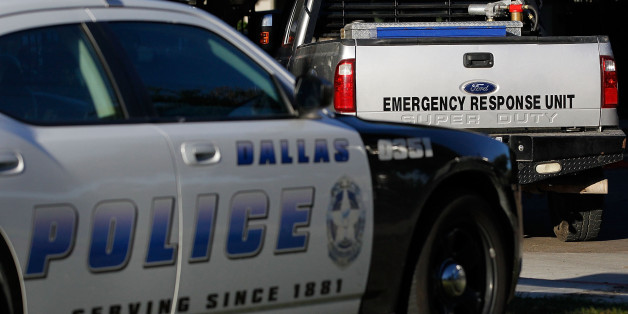 DALLAS, TX - OCTOBER 16: A Dallas police car and an emergency response vehicle sit in the parking lot at the The Village Bend East apartment complex where a second health care worker who has tested positive for the Ebola virus resides on October 16, 2014 in Dallas, Texas. Nurse Amber Vinson joins Nina Pham as health workers who have contracted the Ebola virus at Texas Heath Presbyterian Hospital while treating patient Thomas Eric Duncan, who has since died. (Photo by Mike Stone/Getty Images)