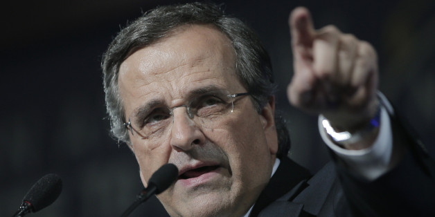 Greece's Prime Minister Antonis Samaras delivers his final campaign speech at the Taekwondo Indoor Stadium in southern Athens on Friday, Jan. 23, 2015. All opinion polls on Sunday's closely-watched national election agree: The radical left opposition Syriza party, which has vowed to rewrite the terms of Greece's international bailout, enjoys a lead of at least 4 percentage points over Prime Minister Antonis Samaras' conservatives. (AP Photo/Lefteris Pitarakis)