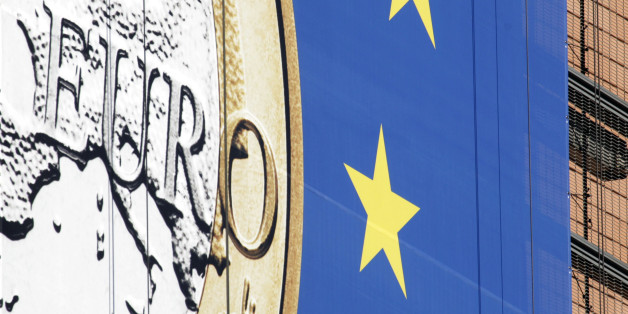 The euro sign is seen on the side of the building of EU headquarters in Brussels on Monday, Feb. 20, 2012. Leaders from Germany, Italy and Greece have said they are optimistic that the deal on a second massive bailout for Athens can be clinched at a meeting of EU finance ministers on Monday after months of delay, but critics have expressed doubts over Greek political leaders' commitment to austerity and there are still difficult details to be ironed out. (AP Photo/Virginia Mayo)