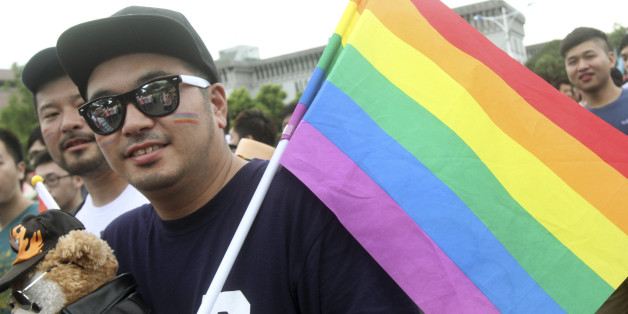 A participant revels through a street during gay and lesbian parade in Taipei, Taiwan, Saturday, Oct. 25, 2014. Thousands of gay and lesbian Taiwanese took to the streets showing Taiwan's acceptance of alternative lifestyles and activities from traditional ways of Chinese life. (AP Photo/Chiang Ying-ying)
