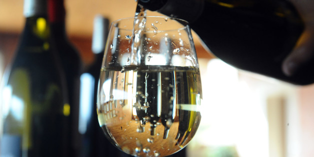 A picture taken on October 10, 2012 shows French wine owner and producer Caroline Cassot pouring white wine in a glass in Prayssac, in the French southwestern wine producing region of Cahors. Caroline Cassot will produce a Cahors white wine, although Cahors wines are usually red wines from grapes grown in or around the town of Cahors. AFP PHOTO / REMY GABALDA (Photo credit should read REMY GABALDA/AFP/GettyImages)