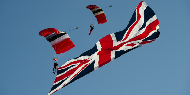 LONDON - JULY 10: The Red Devils perform an aerial display as Prince Charles, Prince of Wales attends a Parachute Regiment Fundraising Dinner pre-dinner reception at the Honourable Artillery Company barracks, on July 10, 2013 in London, England. (Photo by Anthony Devlin - WPA Pool/Getty Images)