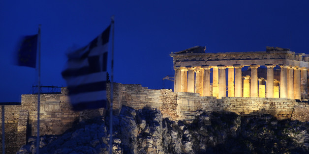 The flags of Greece, 2nd left, and European Union flutter from the roof of the Finance Minister at Athens' main Syntagma square, as in the background is seen the ancient Parthenon temple during in Athens on Thursday Feb, 9, 2012. Greece's deputy labor minister has resigned to protest demanded new austerity measures. Yiannis Koutsoukos issued a statement on Thursday saying he opposes implementation of cutbacks and reforms agreed earlier Thursday to secure the country's international rescue loan lifeline. Koutsoukos is a lawmaker with the majority Socialist party. (AP Photo/Dimitris Messinis)