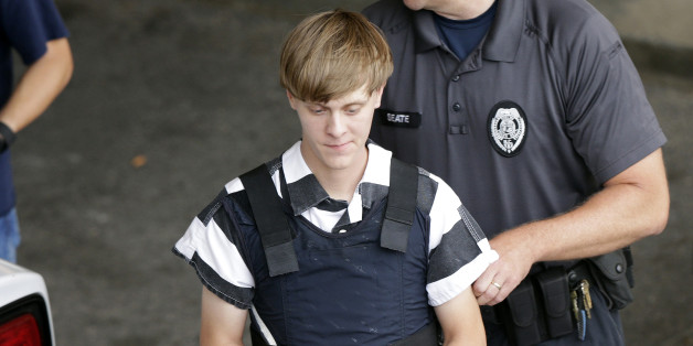 Charleston, S.C., shooting suspect Dylann Storm Roof is escorted from the Cleveland County Courthouse in Shelby, N.C., Thursday, June 18, 2015. Roof is a suspect in the shooting of several people Wednesday night at the historic The Emanuel African Methodist Episcopal Church in Charleston. (AP Photo/Chuck Burton)