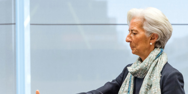 Managing Director of the International Monetary Fund Christine Lagarde reaches out to shake hands as she arrives for a meeting of eurogroup finance ministers at the European Council LEX building in Brussels on Monday, June 22, 2015. Heads of state in the eurogroup meet in Brussels on Monday for a special summit to discuss the financial crisis with Greece. (AP Photo/Geert Vanden Wijngaert)