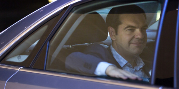 Greek Prime Minister Alexis Tsipras leaves in his car after a meeting at EU headquarters in Brussels on Wednesday, June 24, 2015. Eurozone finance ministers meet Wednesday to discuss the Greek bailout. (AP Photo/Virginia Mayo)