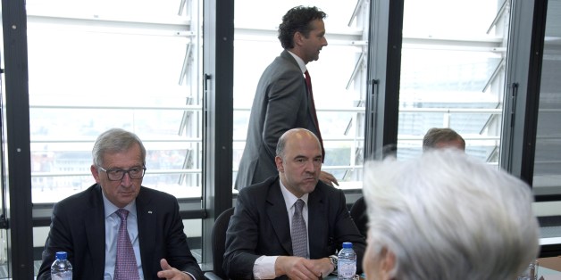 European Commission President Jean-Claude Juncker (L) and European Commissioner for Economic and Financial Affairs, Taxation and Customs Pierre Moscovici (2nd L), President of the Eurogroup Jeroen Dijsselbloem (3rd L) and International Monetary Fund (IMF) Managing Director Christine Lagarde (R) arrive for a meeting on Greece at the European Commission in Brussels on June 24, 2015. Greek Prime Minister Alexis Tsipras was summoned to Brussels for a decisive meeting with key EU-IMF creditors on Jun