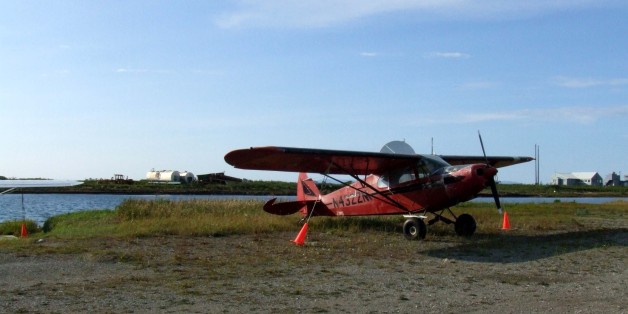 The main airstrip runs <a href="http://maps.google.com/maps?f=q&hl=en&geocode=&q=Kotzebue,+AK&dirflg=w&ie=UTF8&ll=66.88158,-162.597485&spn=0.032285,0.153122&t=h&z=13">east-west</a> in Kotzebue with another smaller strip running north-south. Along this strip a few prop planes were being stored.
Michaela and I drove on this for a bit before we realized that the beach access was actually just to the east of this strip.