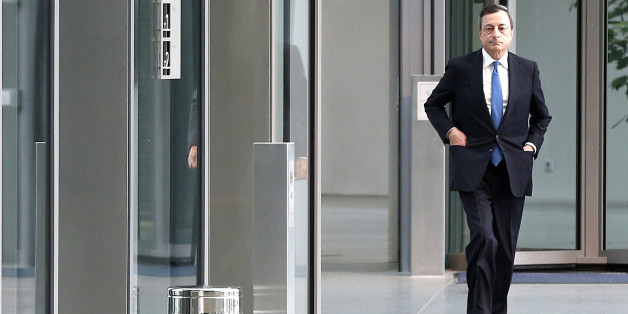 The president of the European Central Bank Mario Draghi, walks in the lobby of the ECB on his way to meet France's Prime Minister Manuel Valls in Frankfurt, Germany, Tuesday, June 23, 2015. (AP Photo/Michael Probst)
