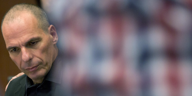 Greek Finance Minister Yanis Varoufakis waits for the start of a meeting of eurogroup finance ministers in Brussels on Saturday, June 27, 2015. Anxiety over Greece's future swelled on Saturday after Prime Minister Alexis Tsipras' call to have the people vote on a proposed bailout deal increases the risks that the country might fall out of the euro. (AP Photo/Virginia Mayo)