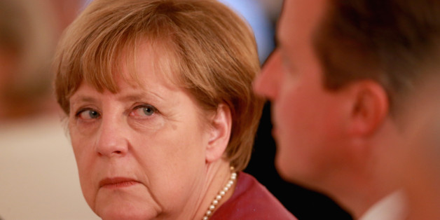 BERLIN, GERMANY - JUNE 24: Angela Merkel glances at British Prime Minister David Cameron during a State Banquet at the Schloss Bellevue Palace on the second day of a four day State Visit on June 24, 2015 in Berlin, Germany. (Photo by Chris Jackson - WPA Rota/Getty Images)