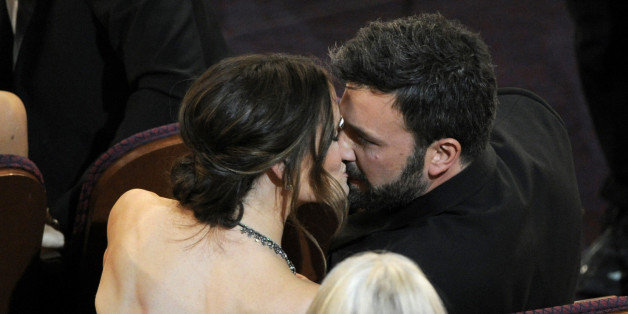 Jennifer Garner, left, kisses director Ben Affleck after "Argo" is announced the winner for the award for best picture during the Oscars at the Dolby Theatre on Sunday Feb. 24, 2013, in Los Angeles. (Photo by Chris Pizzello/Invision/AP)