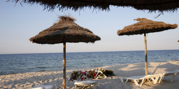 Lounge chairs and numerous flowers laid out at the scene of the attack in Sousse, Tunisia, Sunday, June 28, 2015. The Friday attack on tourists at a beach is expected to be a huge blow to Tunisia's tourism sector, which made up nearly 15 percent of the country's gross domestic product in 2014. (AP Photo/Abdeljalil Bounhar)