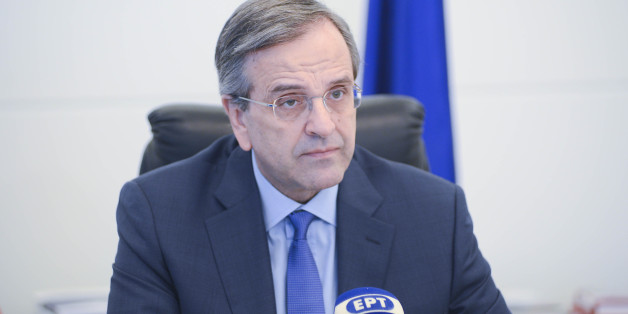 Greece's Prime Minister Antonis Samaras delivers his final campaign speech at the Taekwondo Indoor Stadium in southern Athens on Friday, Jan. 23, 2015. All opinion polls on Sunday's closely-watched national election agree: The radical left opposition Syriza party, which has vowed to rewrite the terms of Greece's international bailout, enjoys a lead of at least 4 percentage points over Prime Minister Antonis Samaras' conservatives. (AP Photo/Lefteris Pitarakis)