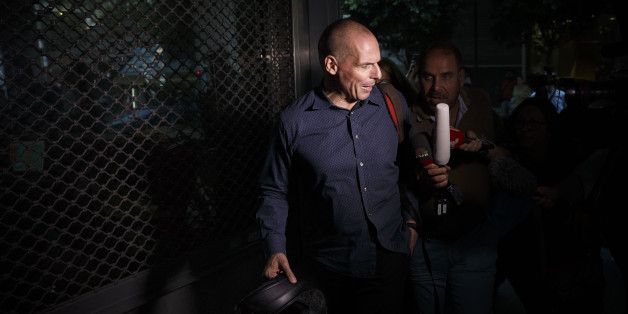 Greece's Finance Minister Yanis Varoufakis answers questions as he leaves his office in Athens, Wednesday, July 1, 2015. About 1,000 bank branches around the country were ordered by the government to reopen Wednesday to help desperate pensioners without ATM cards cash up to 120 euros ($134) from their retirement checks. Eurozone finance ministers were set to weigh Greece's latest proposal for aid Wednesday. (AP Photo/Daniel Ochoa de Olza)