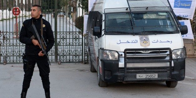 A Tunisian policeman stands guard in front of Tunisia's Bardo National Museum on March 23, 2015 in Tunis, on the eve of its reopening, six days after it witnessed a massacre of foreign tourists. AFP PHOTO / FADEL SENNA (Photo credit should read FADEL SENNA/AFP/Getty Images)