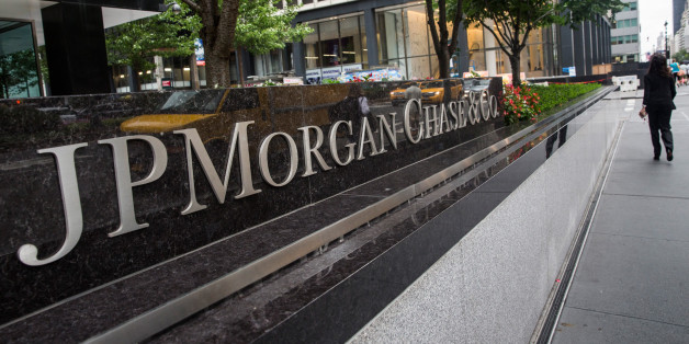 NEW YORK, NY - AUGUST 12: A woman walks past JP Morgan Chase's corporate headquarters on August 12, 2014 in New York City. U.S. banks announced second quarter profits of more than $40 billion, showing strong signs of a recovering economy. (Photo by Andrew Burton/Getty Images)