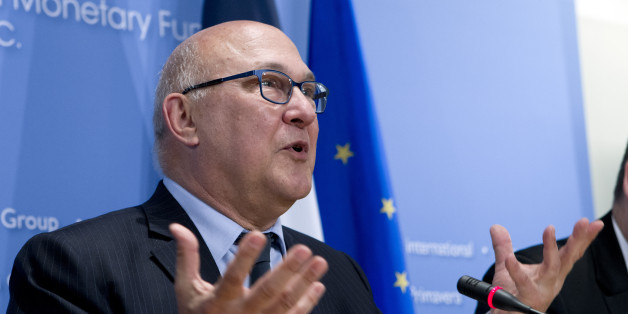 France's Finance Minister Michel Sapin speaks during a news conference after the IMFC meeting at the World Bank-International Monetary Fund annual meetings in Washington, Saturday, April 18, 2015. ( AP Photo/Jose Luis Magana)