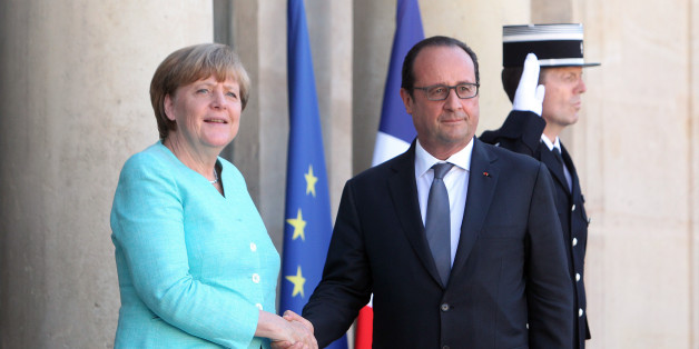 France's President Francois Hollande, right, and German chancellor Angela Merkel shake hands prior to a meeting, at the Elysee Palace, in Paris, France, Monday, July 6, 2015. German Chancellor Angela Merkel has arrived at the Elysee Palace for talks with French President Francois Hollande about the Greek crisis. The two are expected to issue a joint statement that's likely to reflect the line to be taken at the summit. France has appeared more conciliatory than Germany toward Greece over the pas