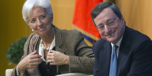 Managing Director of the International Monetary Fund Christine Lagarde, left, and European Central Bank President Mario Draghi, right, smile during a panel on"growth and integration with solidarity, what kind of strategy for Europe?"at the finance ministry in Paris, Friday, Nov. 30, 2012. (AP Photo/Michel Euler)