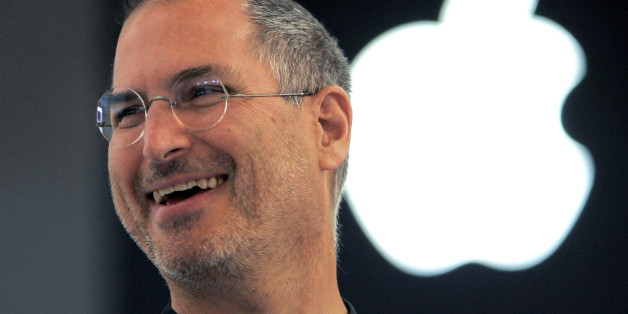Apple Computer Inc. CEO Steve Jobs smilles to reporters after a press conference as he opens the Apple Expo in Paris,Tuesday, Sept. 20, 2005. Jobs acknowledged that some record compagnies were pushing him to raise the price of each song download, currently 99 cents on the U.S. ITunes site.(AP Photo/Christophe Ena)