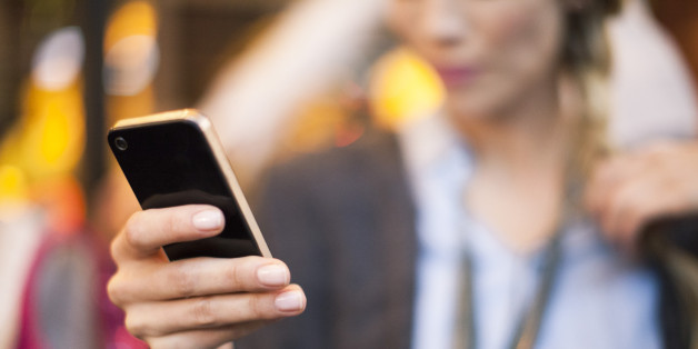 Woman taking selfie with smartphone