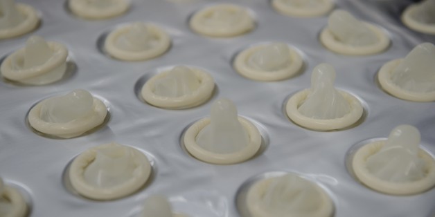 Condoms made with native latex are ready to be packed at the Natex factory that produces around 100 million condoms per year for the Brazilian Health Ministry in Xapuri, Acre State on October 7, 2014. Current production equates to a fifth of the 500 millions condoms -- known as 'camisinhas de Venus' or little Venus shirts in Portuguese -- which the government hands out annually free of charge in a country where according to the UNAIDS non-government organization 730,000 people are HIV-positive. AFP PHOTO / YASUYOSHI CHIBA (Photo credit should read YASUYOSHI CHIBA/AFP/Getty Images)