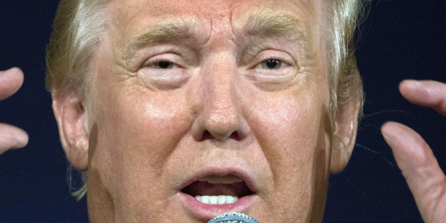 Republican presidential hopeful Donald Trump remarks about Texas Gov. Rick Perry's glasses at his South Carolina campaign rally in Bluffton, S.C., Tuesday, July 21, 2015. (AP Photo/Stephen B. Morton)