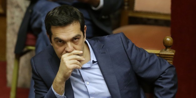 Greece's Prime Minister Alexis Tsipras attends an emergency parliament session in Athens, Wednesday, July 22, 2015. Greece's liquidity-starved banks got a new cash injection from the European Central Bank on Wednesday, hours before a key vote in parliament on further economic reforms demanded by international creditors in return for a third bailout. (AP Photo/Thanassis Stavrakis)