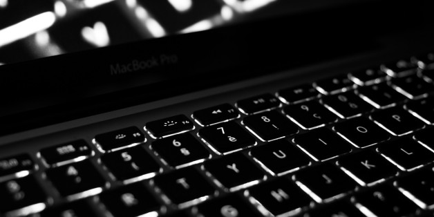 A picture of the keyboard of my MacBook Pro in the dark.